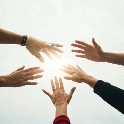 Diverse hands reaching towards a central point, symbolizing community support and outreach