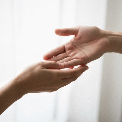 Hands exchanging something, symbolizing giving and receiving